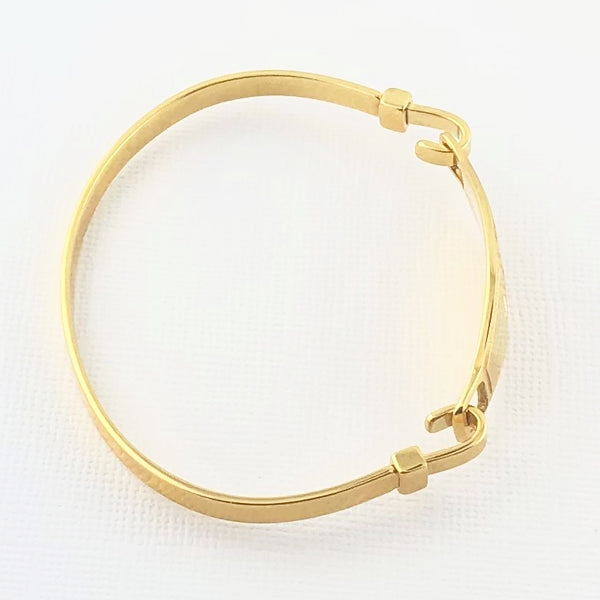 Gold plated bangle medical alert bracelet side view.