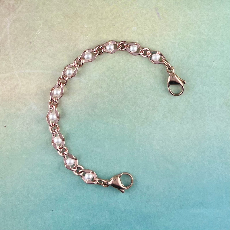Pearl and rose gold replacement medical alert bracelet.