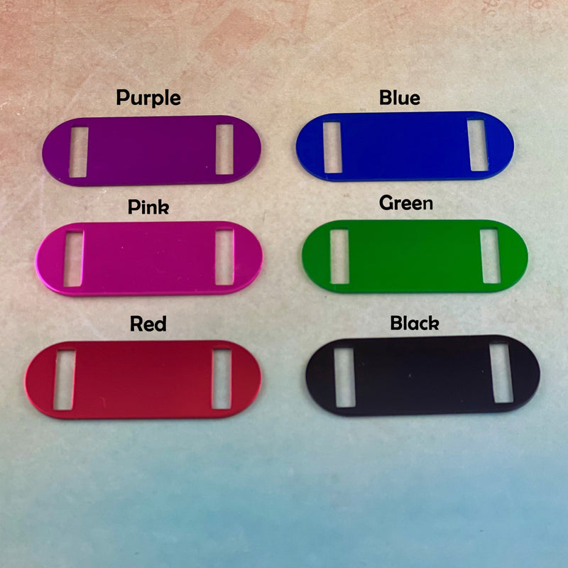 Engravable identification tags in purple, pink, red, blue, green and black.