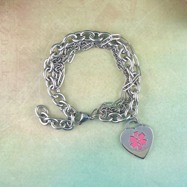 Stainless steel triple chain medical charm bracelet with pink heart shaped medical charm.