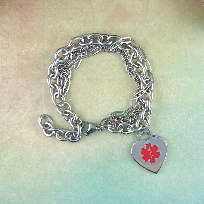 Stainless steel triple chain medical charm bracelet with red heart shaped medical charm.