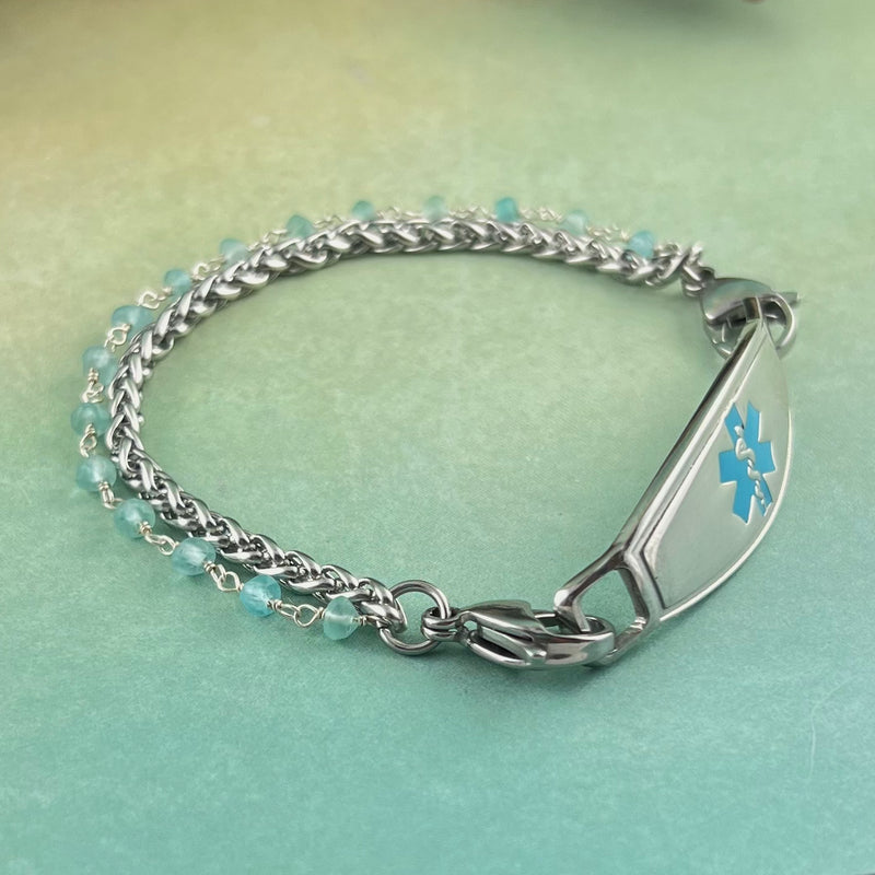 Stainless steel medical ID bracelet with a silver wire wrapped chain with apatite stones in blue.