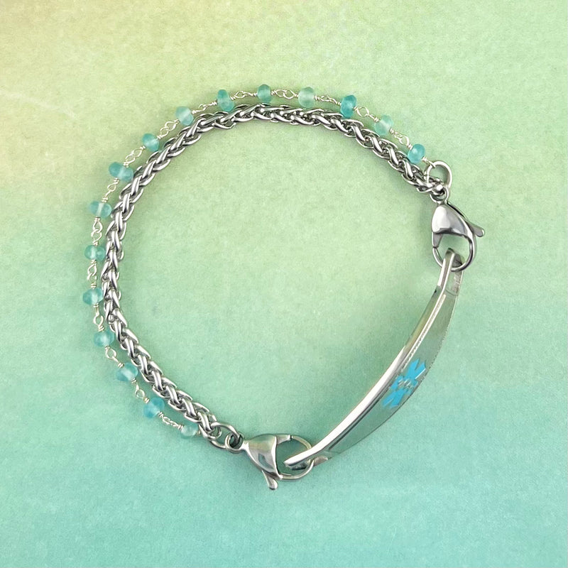 Stainless steel medical ID bracelet with a silver wire wrapped chain with apatite stones in blue.