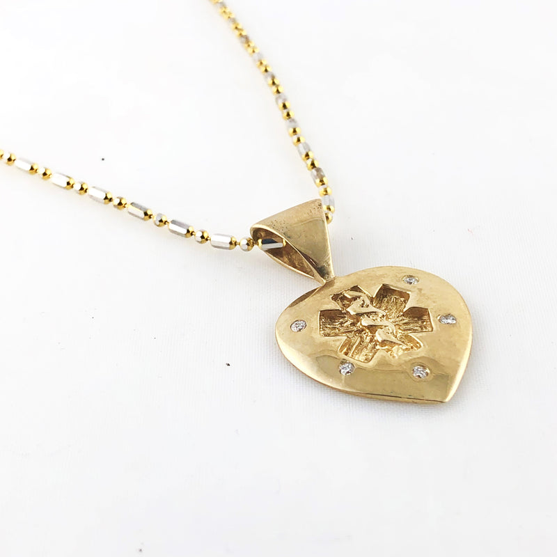 14k Heart shaped medical alert necklace with 5 diamonds.