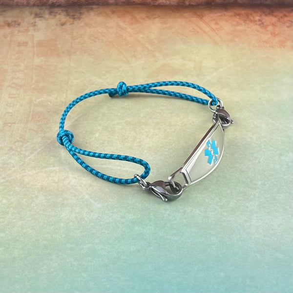 Adjustable blue stretch cord medical alert bracelet with turquoise star of life stainless steel medical ID tag.
