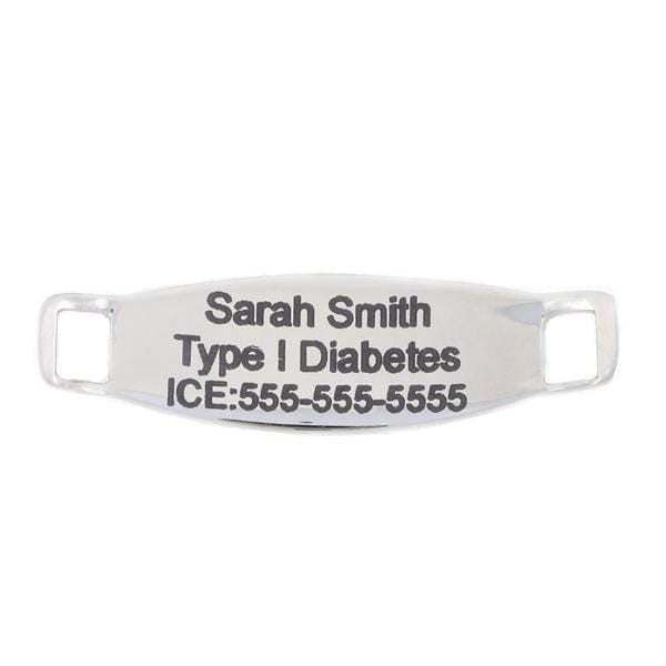 Back side of stainless steel medical alert tag with example of type 1 diabetes engraving.