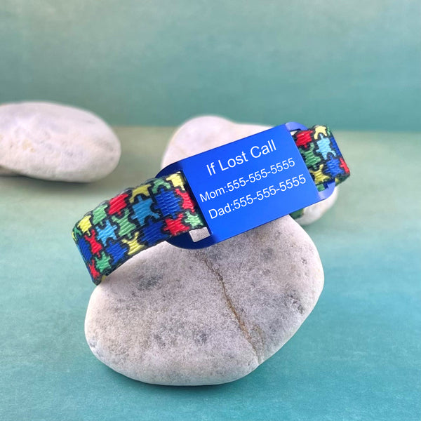 Puzzle print autism ID bracelet if lost with blue personalized ID tag.
