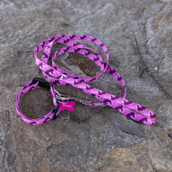 Nylon dog collar and leash set with purple unicorns on  pink background design.