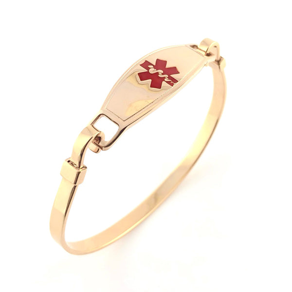 Gold plated bangle medical alert bracelet with red star of life symbol.