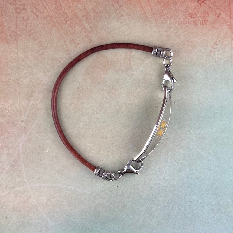 Medical alert bracelet in brown leather with stainless steel lobster clasps and medical ID tag.
