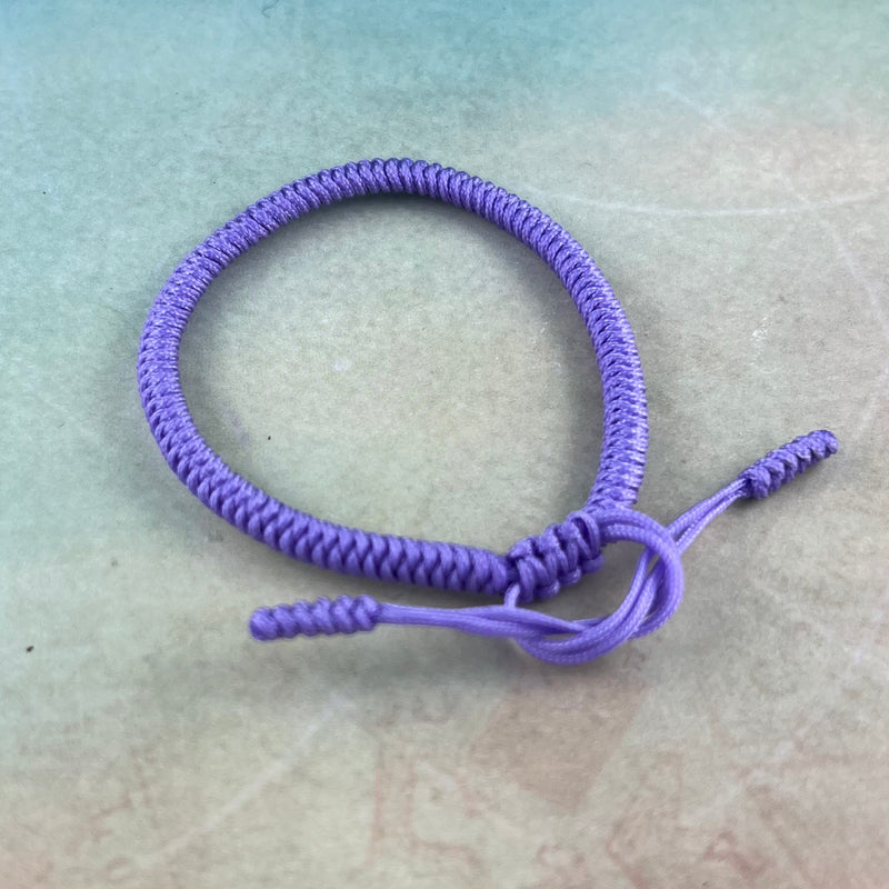 Purple adjustable friendship bracelet.