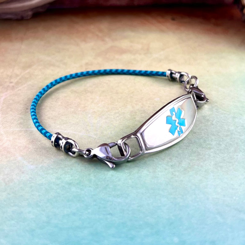 Adjustable blue stretch cord medical alert bracelet with turquoise star of life stainless steel medical ID tag.