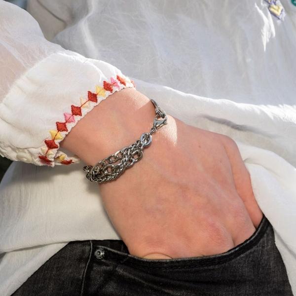 Triple Trend Medical Stainless steel medical alert bracelet with 3 different shaped chains displayed on a woman's wrist.
